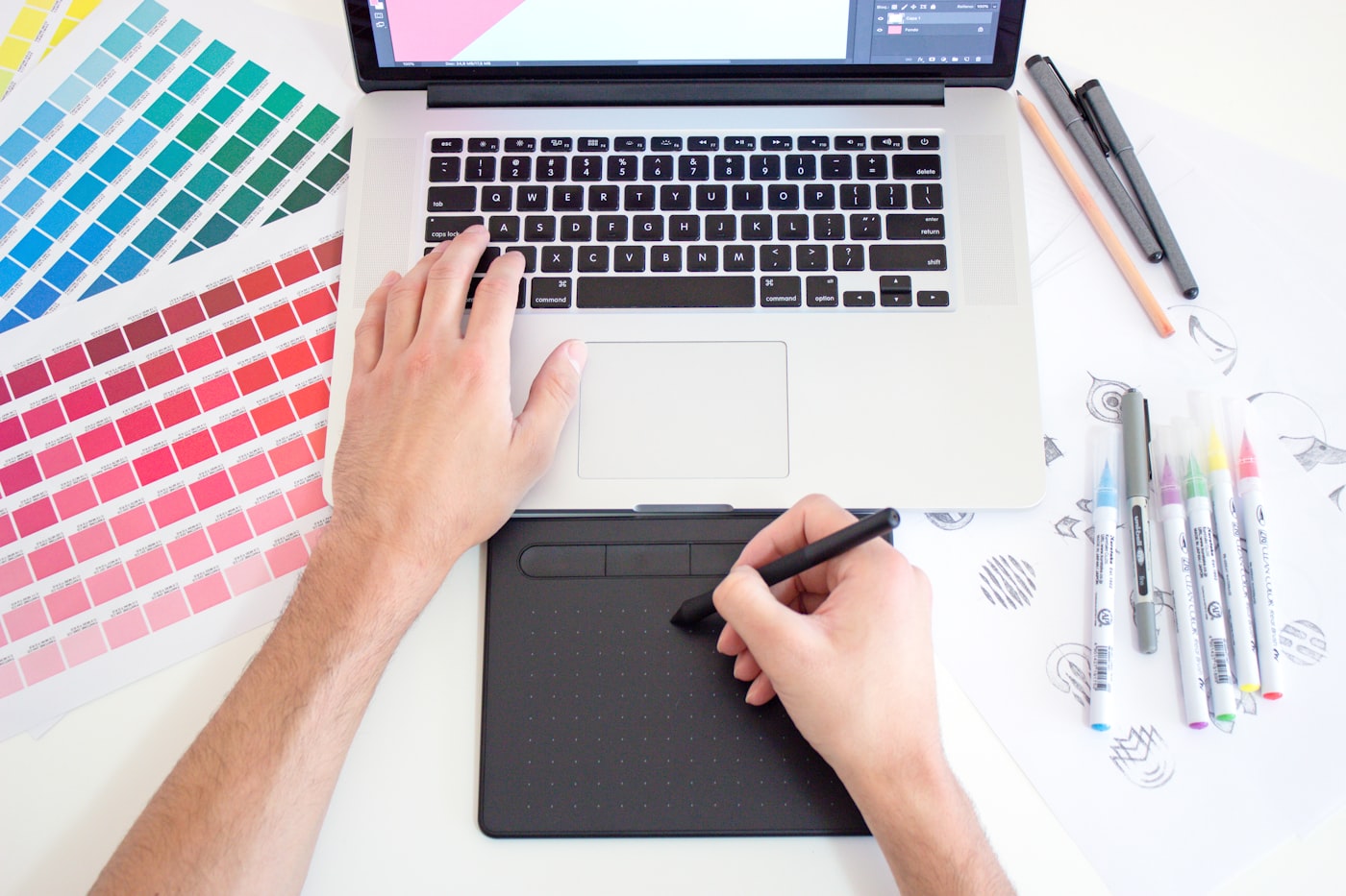 Typical production: drawing tablet, markers, and storyboard sketches on a desk